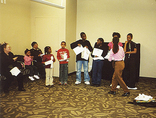 Action Racket workshop participants
					in rehearsal